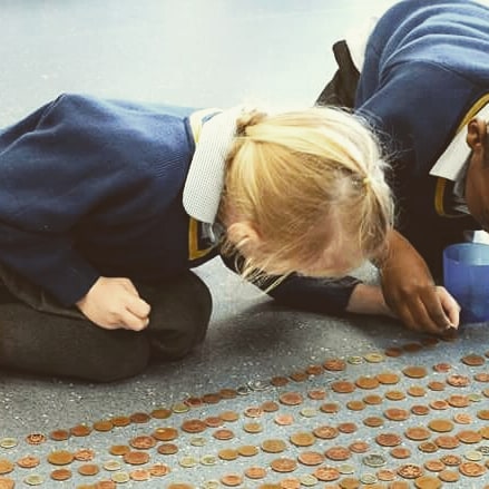 1717589135_Foundation-pupils-attempted-to-cover-the-Refectory-floor-with-coins.jpg